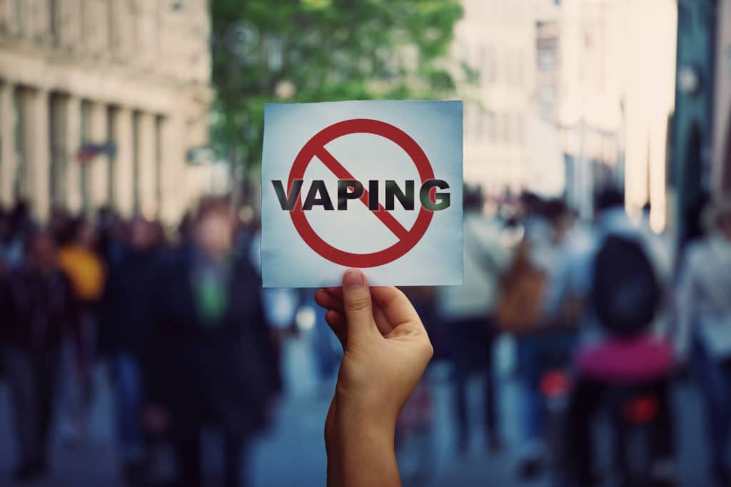 protester holding a stop vaping sign