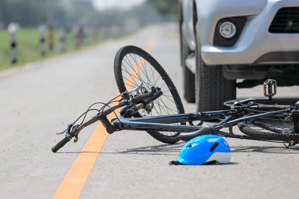 bicycle and helmet run over by car in bicycle accident