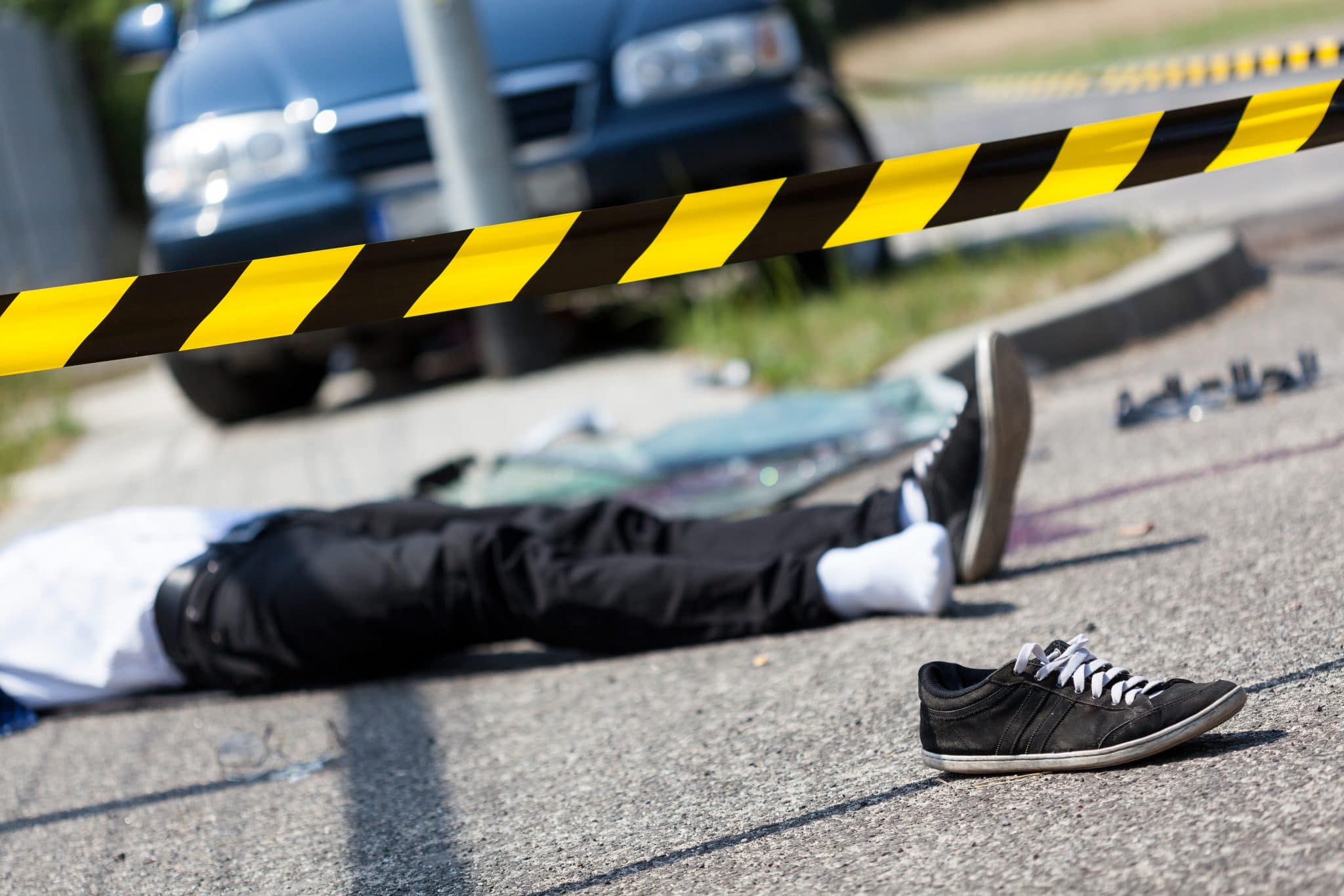 caution tape around a pedestrian accident